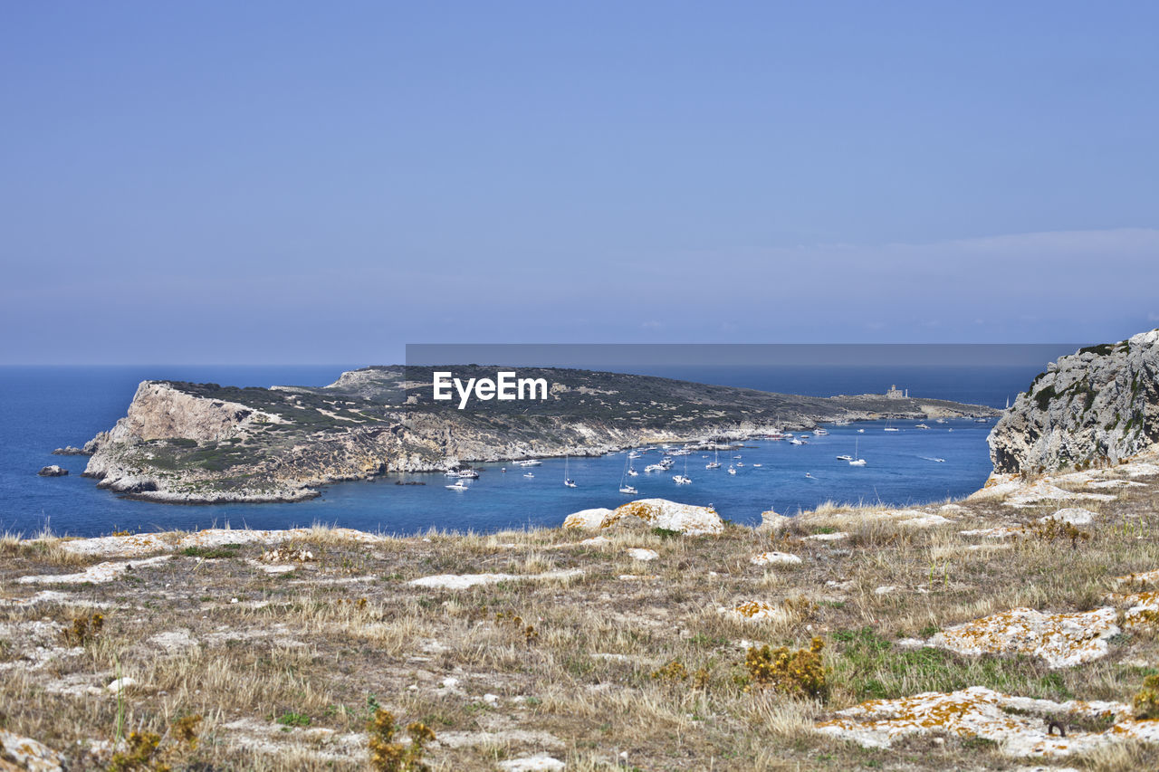 scenic view of sea against clear blue sky