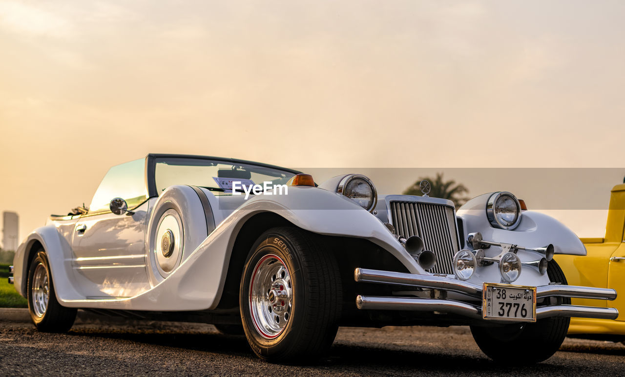 VINTAGE CAR AGAINST SKY