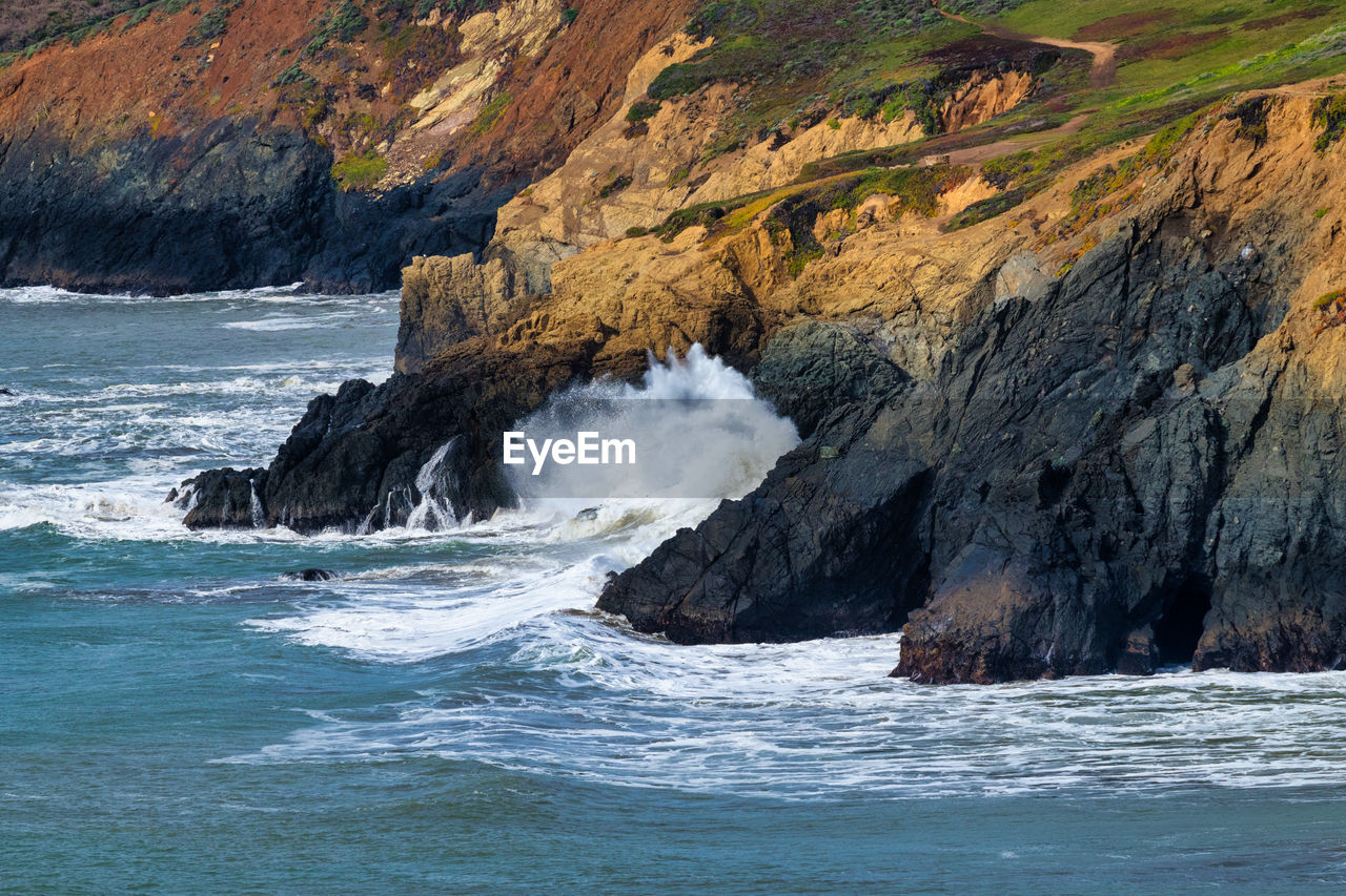 Scenic view of sea against mountain