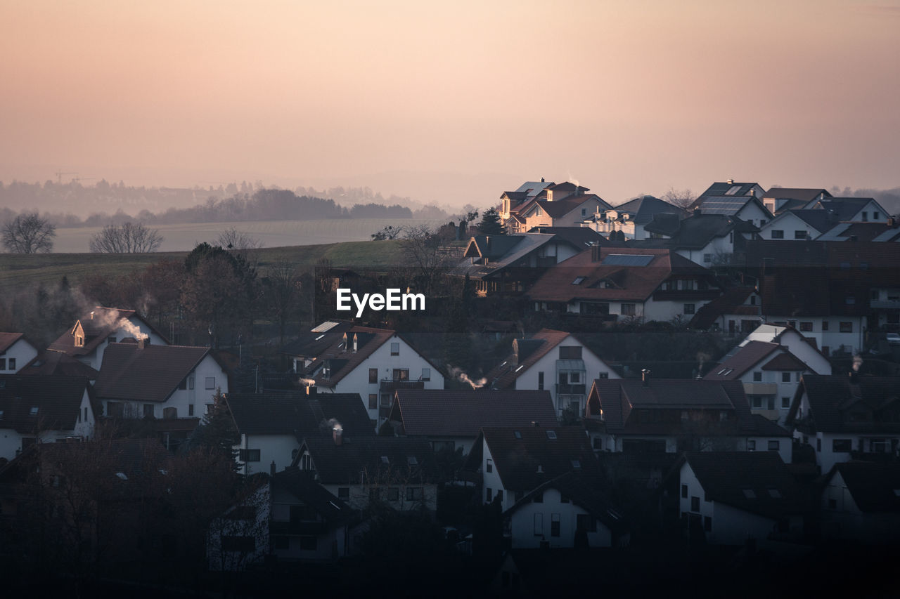 High angle view of townscape against sky at sunset