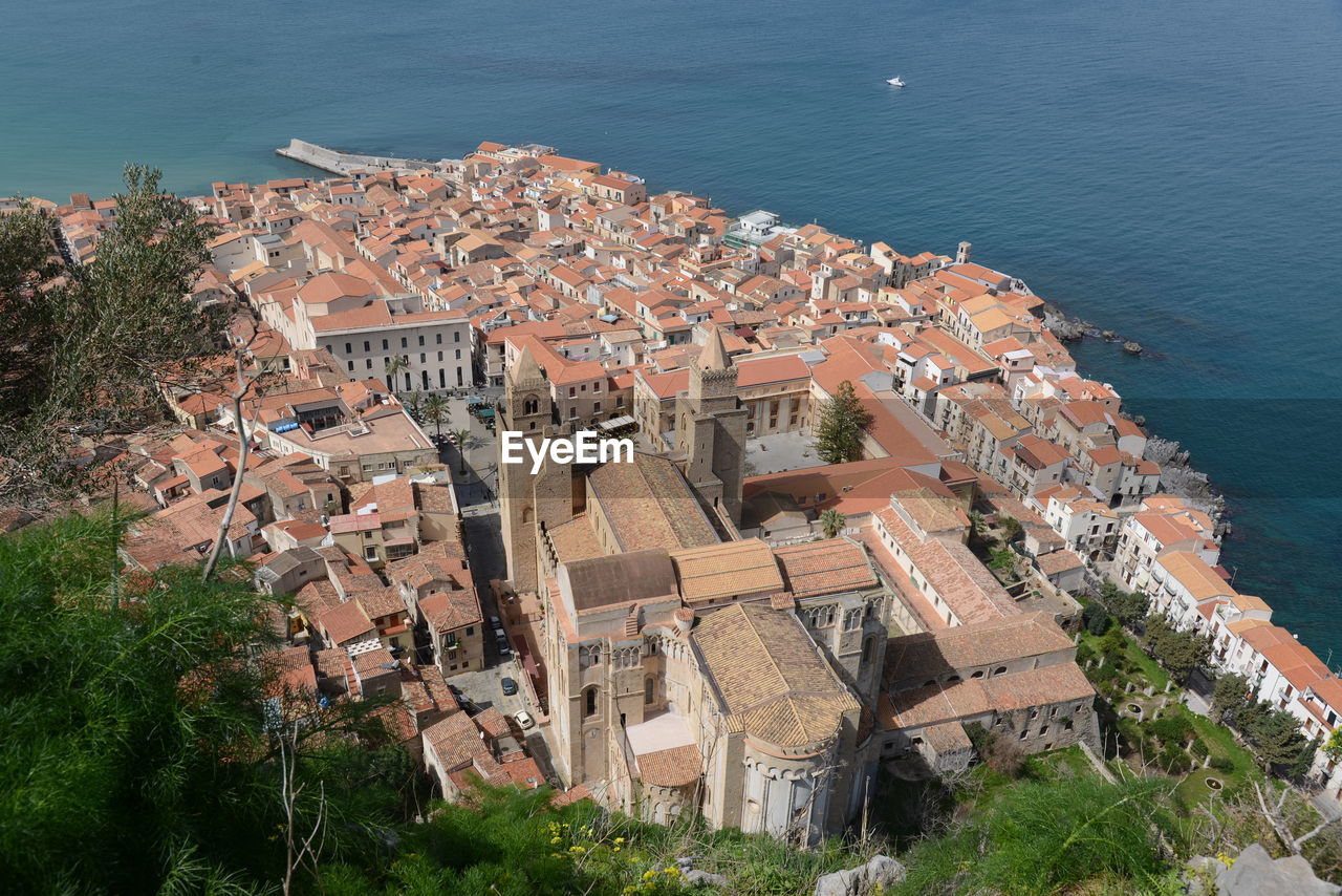 High angle view of townscape by sea