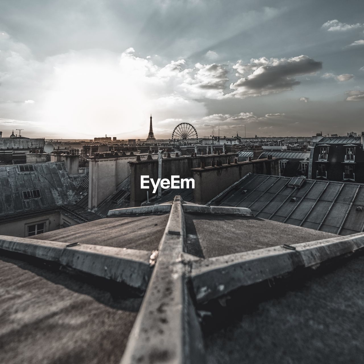 Distant view of eiffel tower against sky in city