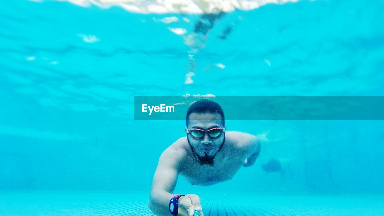 Portrait of man in swimming pool