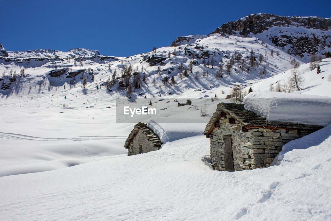 Scenic view of snow covered mountains