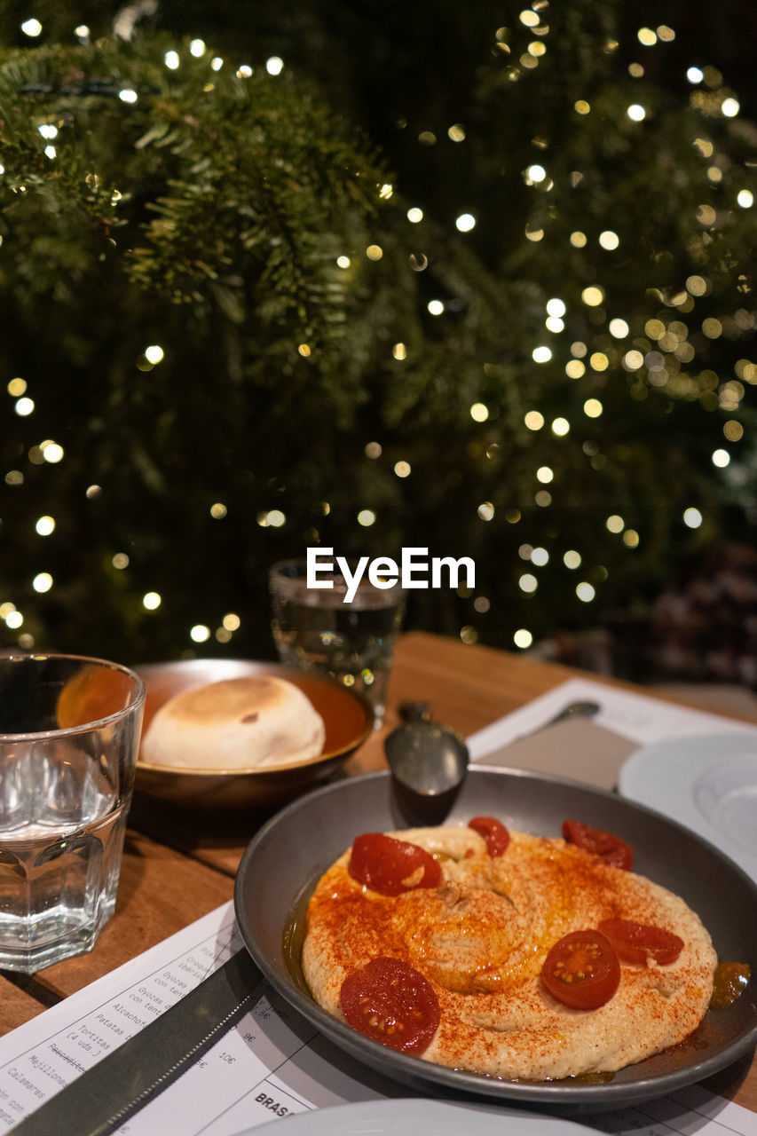 Close-up of food on table, charming lights