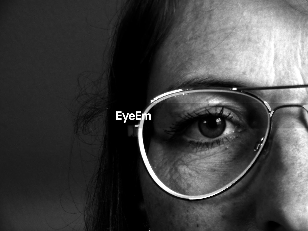 Close-up portrait of woman wearing eyeglasses