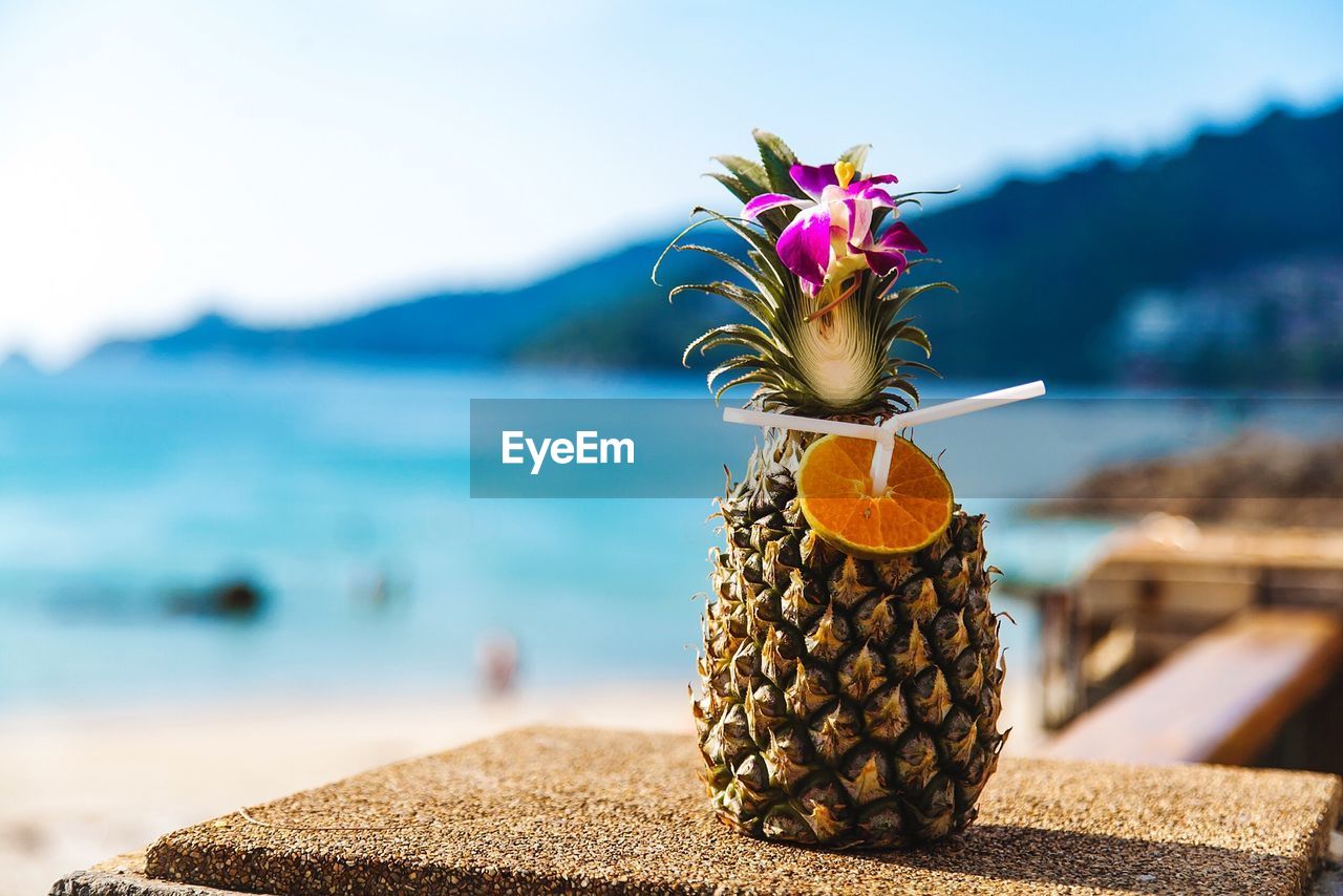 Close-up of drink served in pineapple