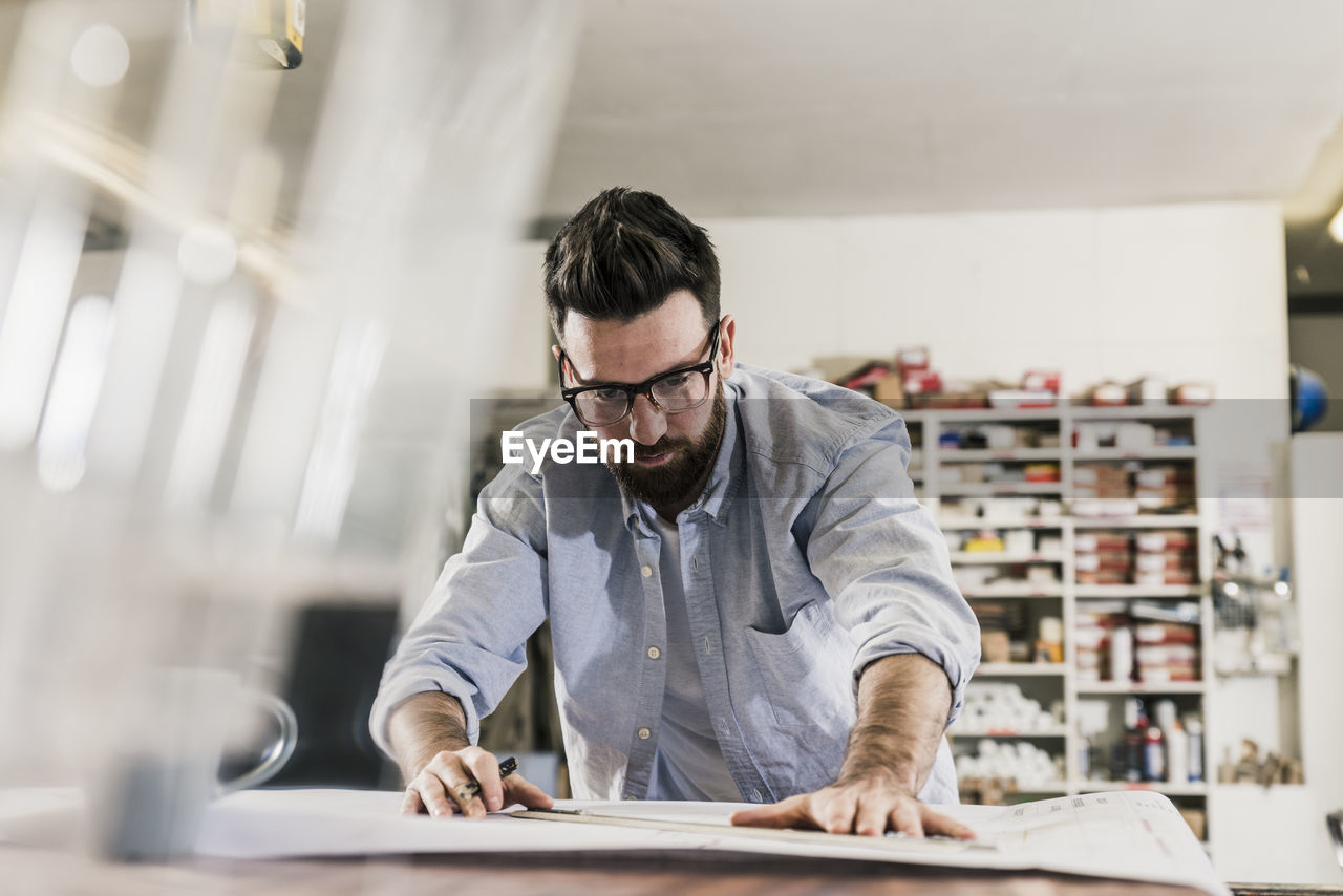 Man working on construction plan