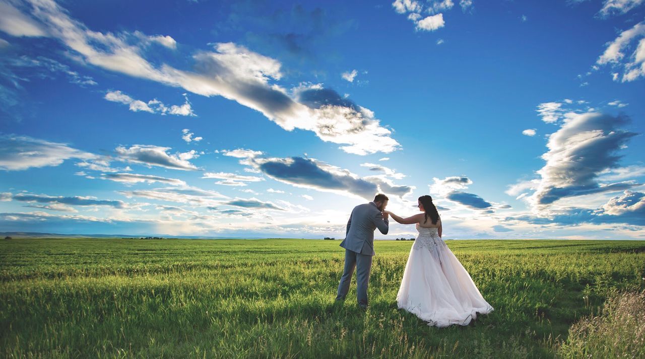 COUPLE KISSING ON FIELD