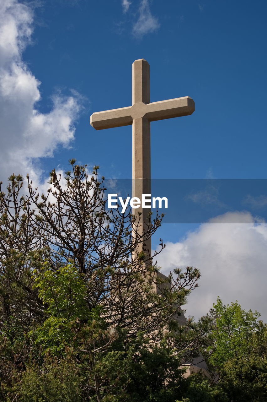 cross, belief, religion, spirituality, sky, catholicism, cloud, cross shape, symbol, crucifix, nature, place of worship, blue, plant, no people, tree, low angle view, grave, outdoors, easter, day, religious equipment, death, architecture, cemetery, tranquility