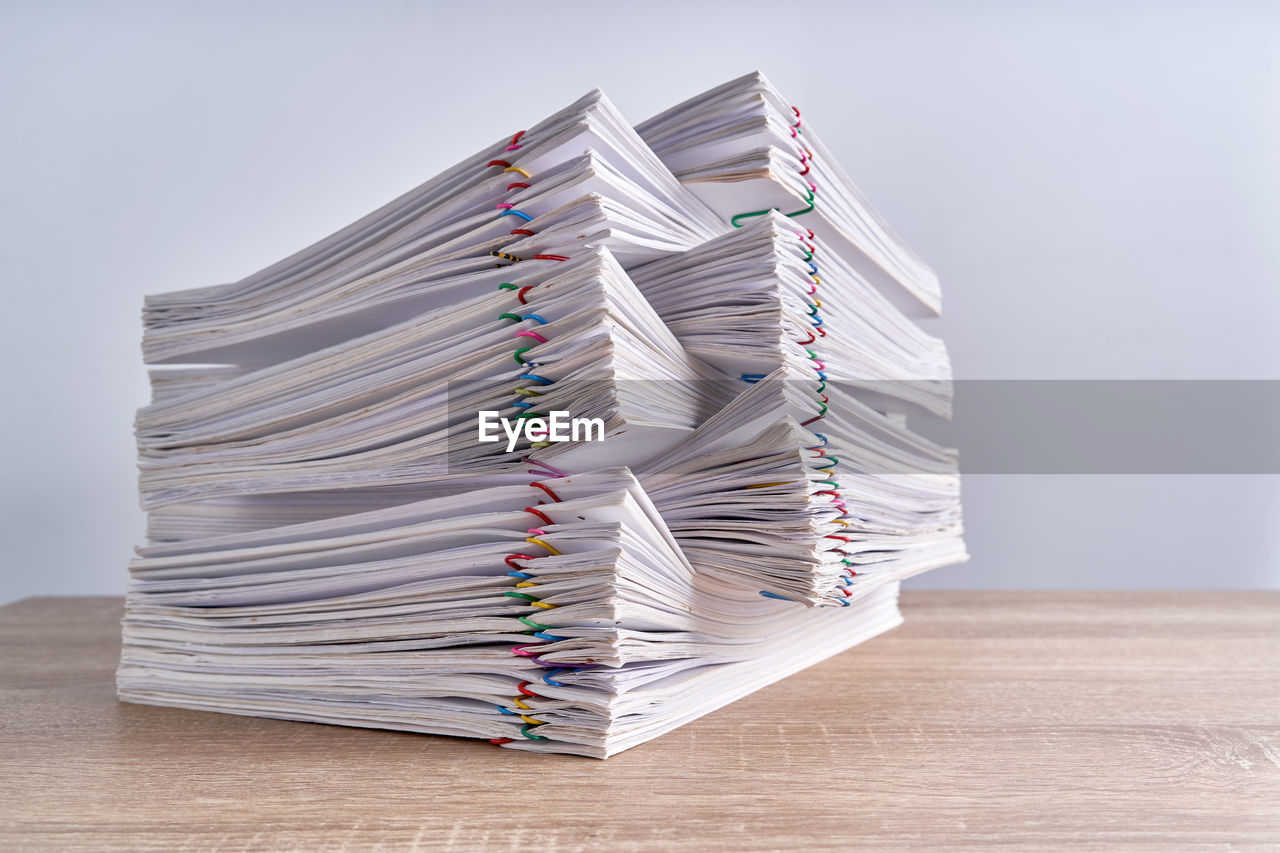 CLOSE-UP OF BOOKS ON TABLE