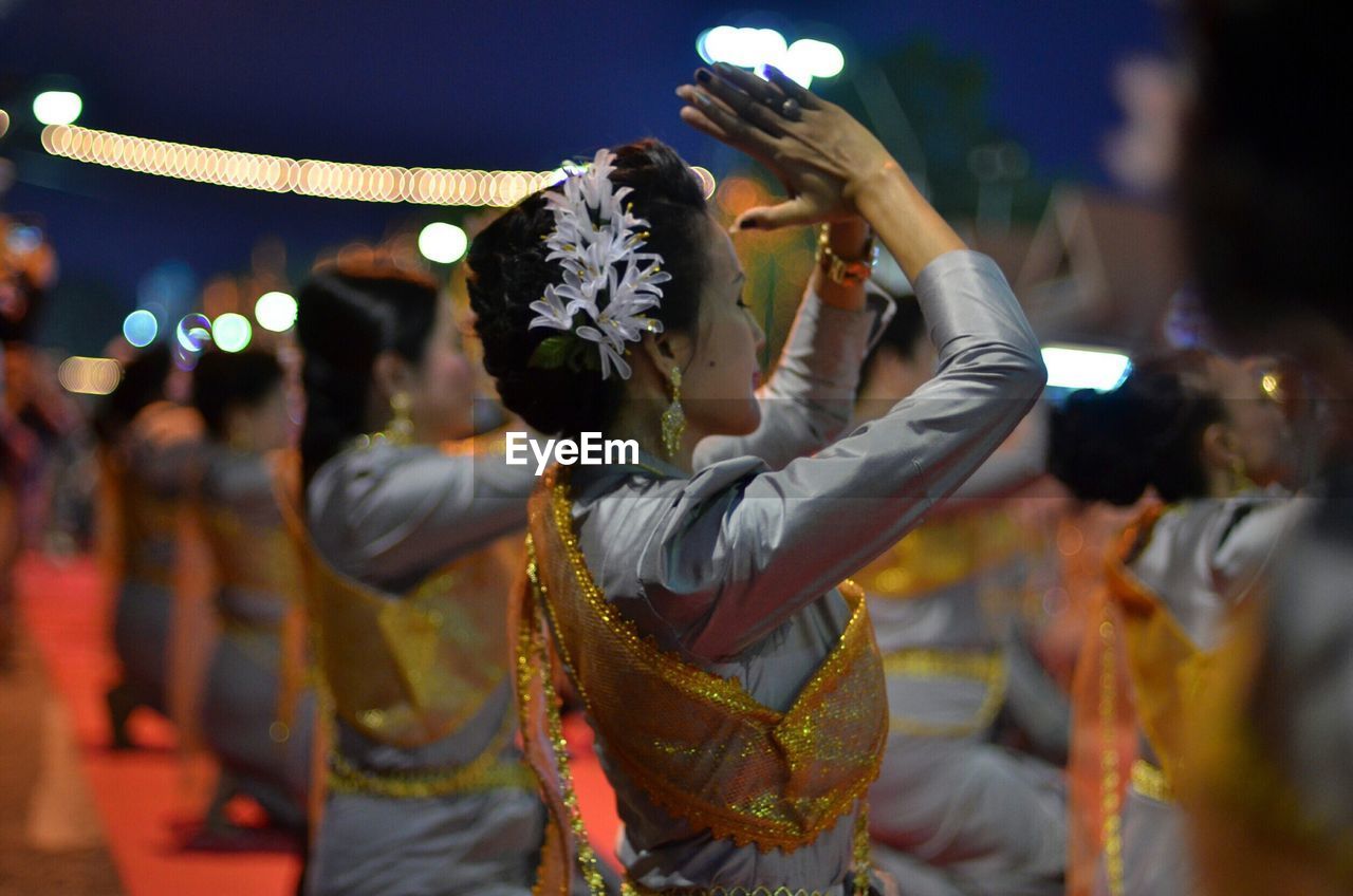 Women dancing on stage at night