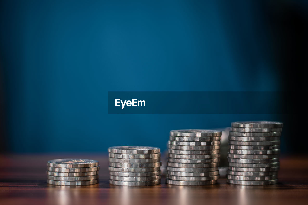 STACK OF COINS ON TABLE AT HOME