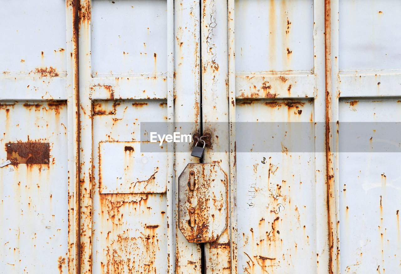 Full frame shot of locked old metallic door