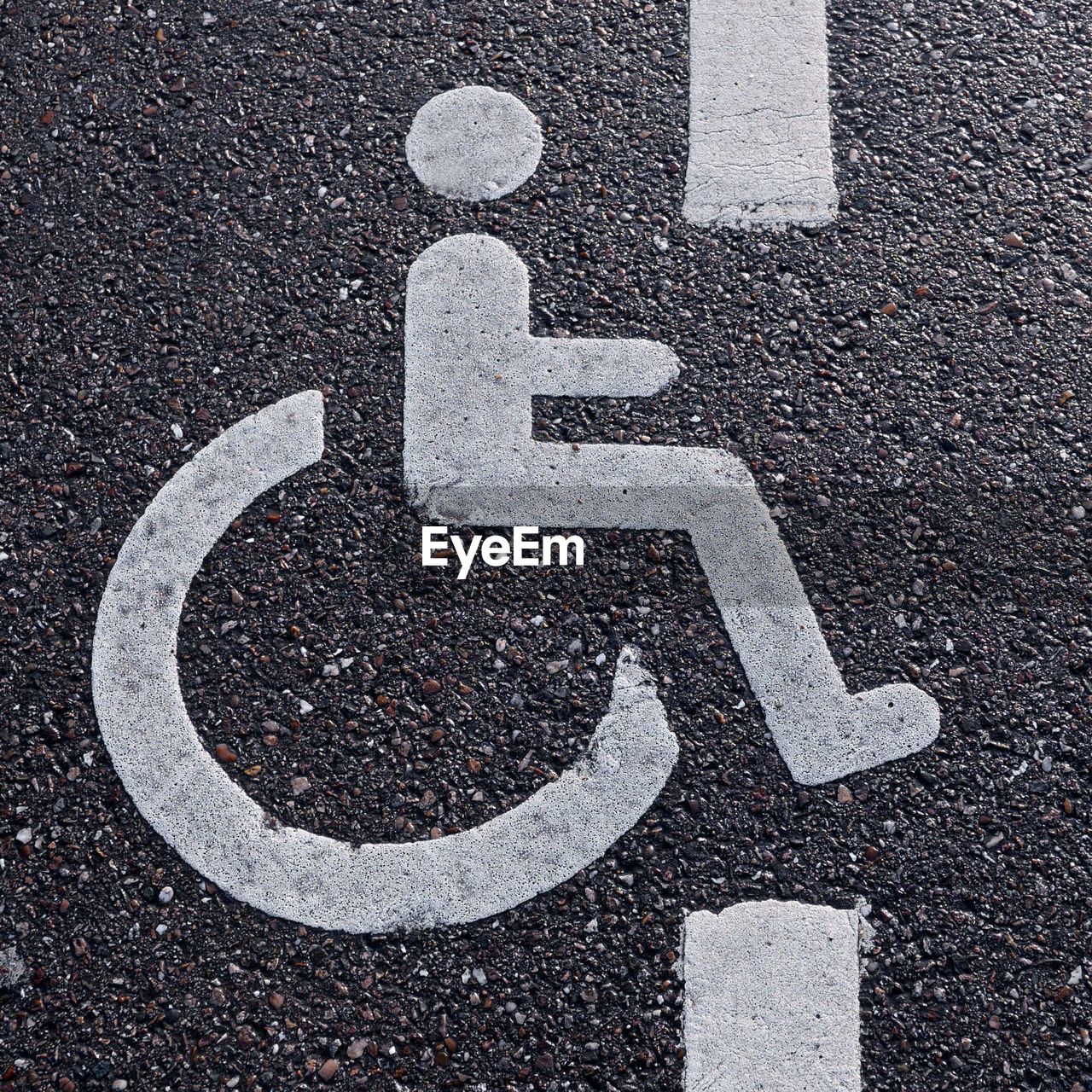 Close-up of handicapped sign on road