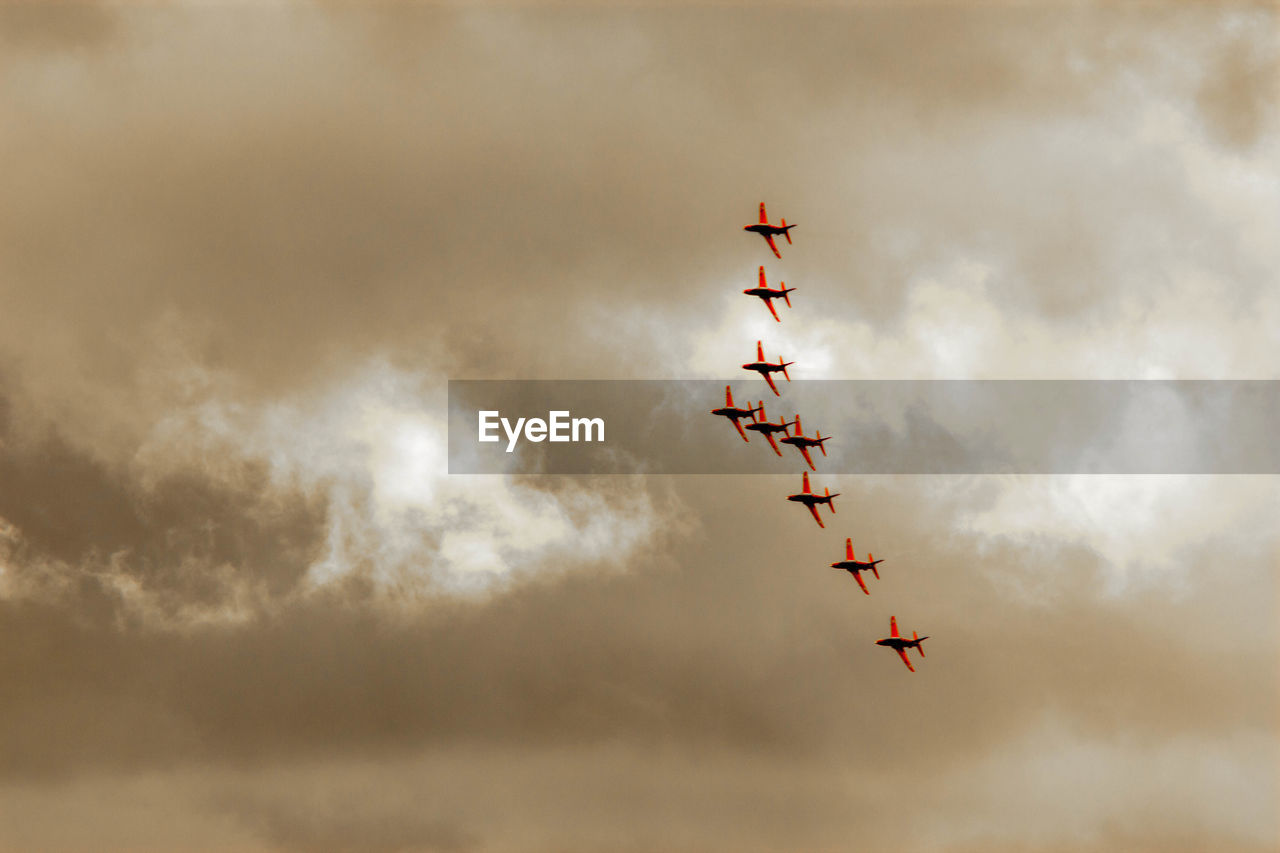 LOW ANGLE VIEW OF AIRPLANE FLYING IN SKY