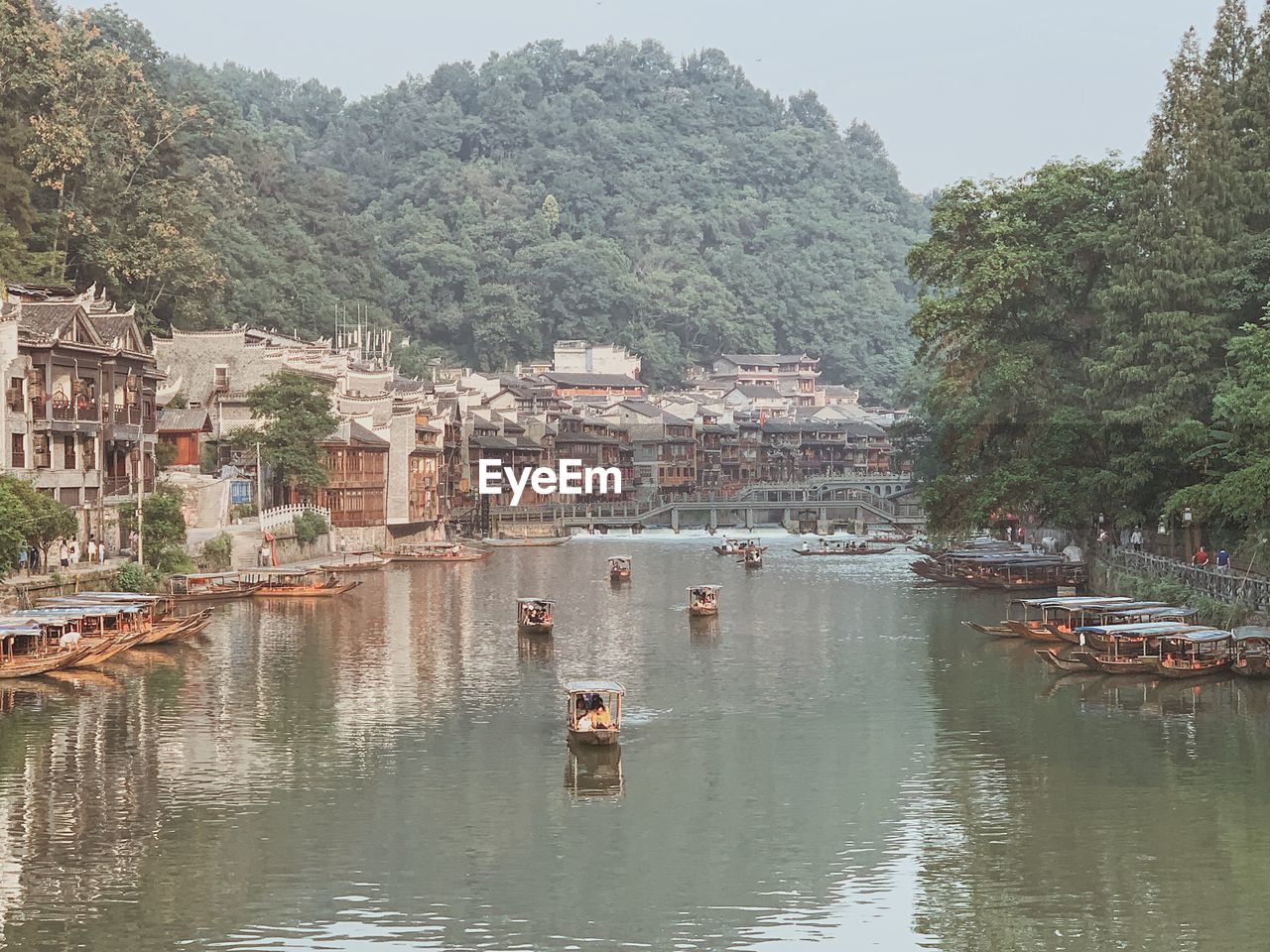 SCENIC VIEW OF RIVER AND BUILDINGS