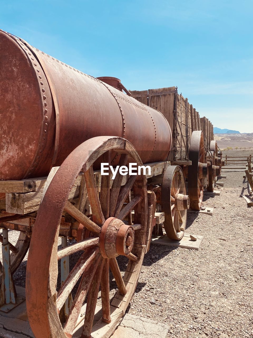 OLD RUSTY WHEEL ON FIELD