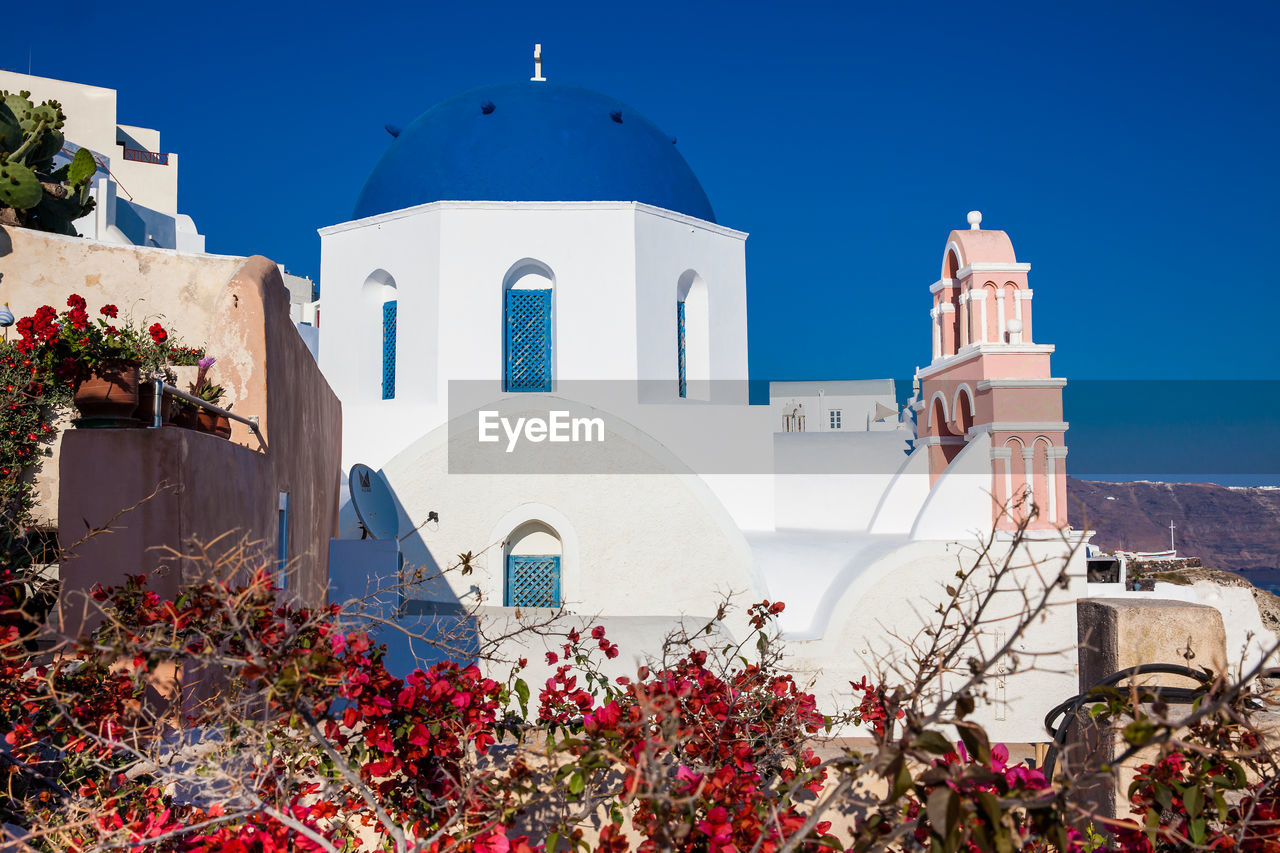 Traditional architecture of the churches of the oia city in santorini island