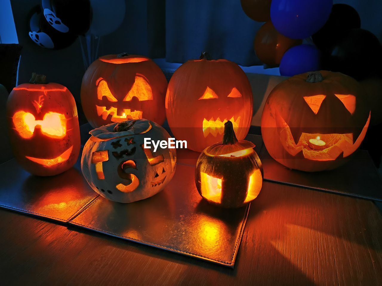 View of illuminated pumpkins on table