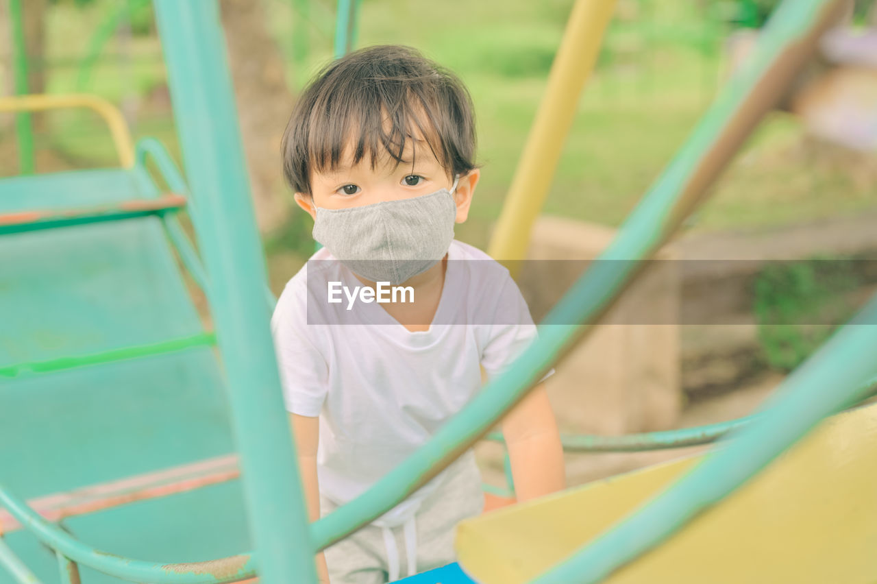 Portrait of cute boy in playground