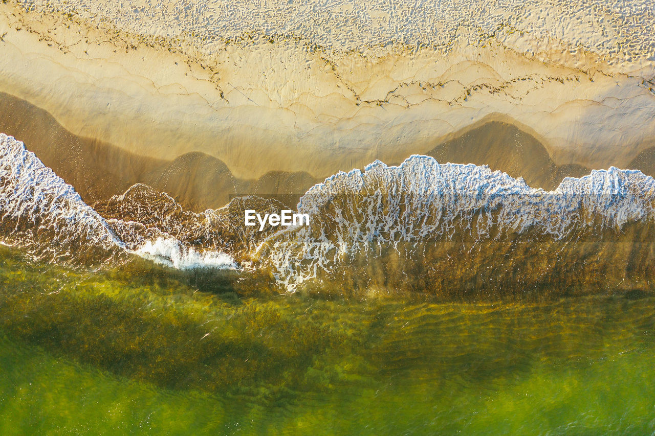 PANORAMIC VIEW OF ROCKS AT SHORE