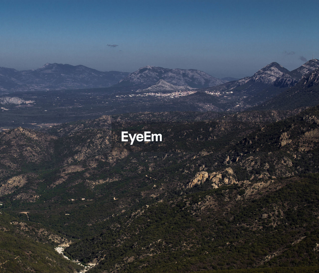 Aerial view of illuminated mountains against sky at night