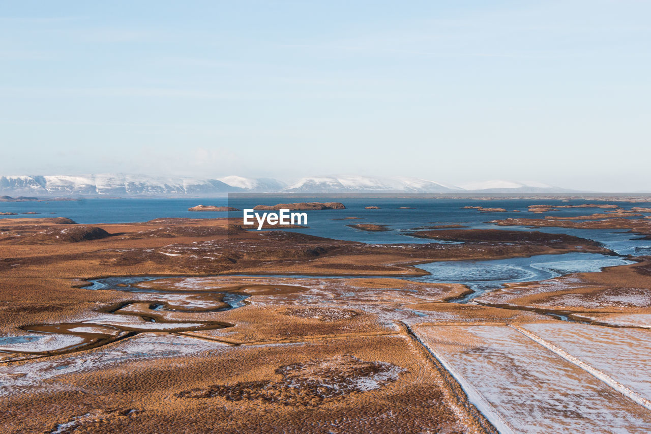 Scenic view of sea against sky during winter