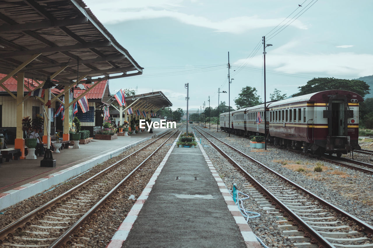 Train at railroad station against sky