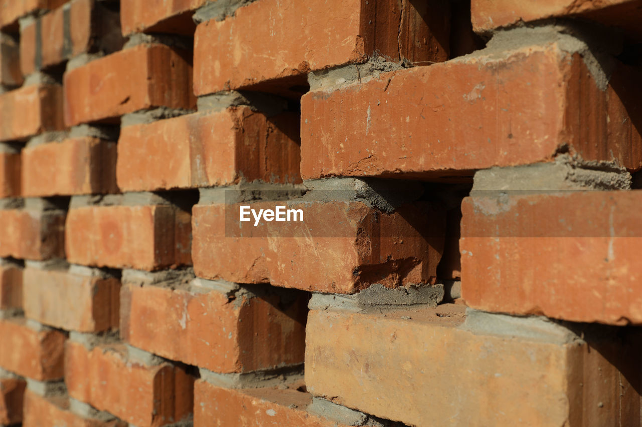 brick, brickwork, backgrounds, wall, full frame, brick wall, no people, architecture, pattern, construction material, brown, industry, large group of objects, wood, close-up, in a row, built structure, wall - building feature, floor, construction industry, red, textured, outdoors, hardwood, day, block