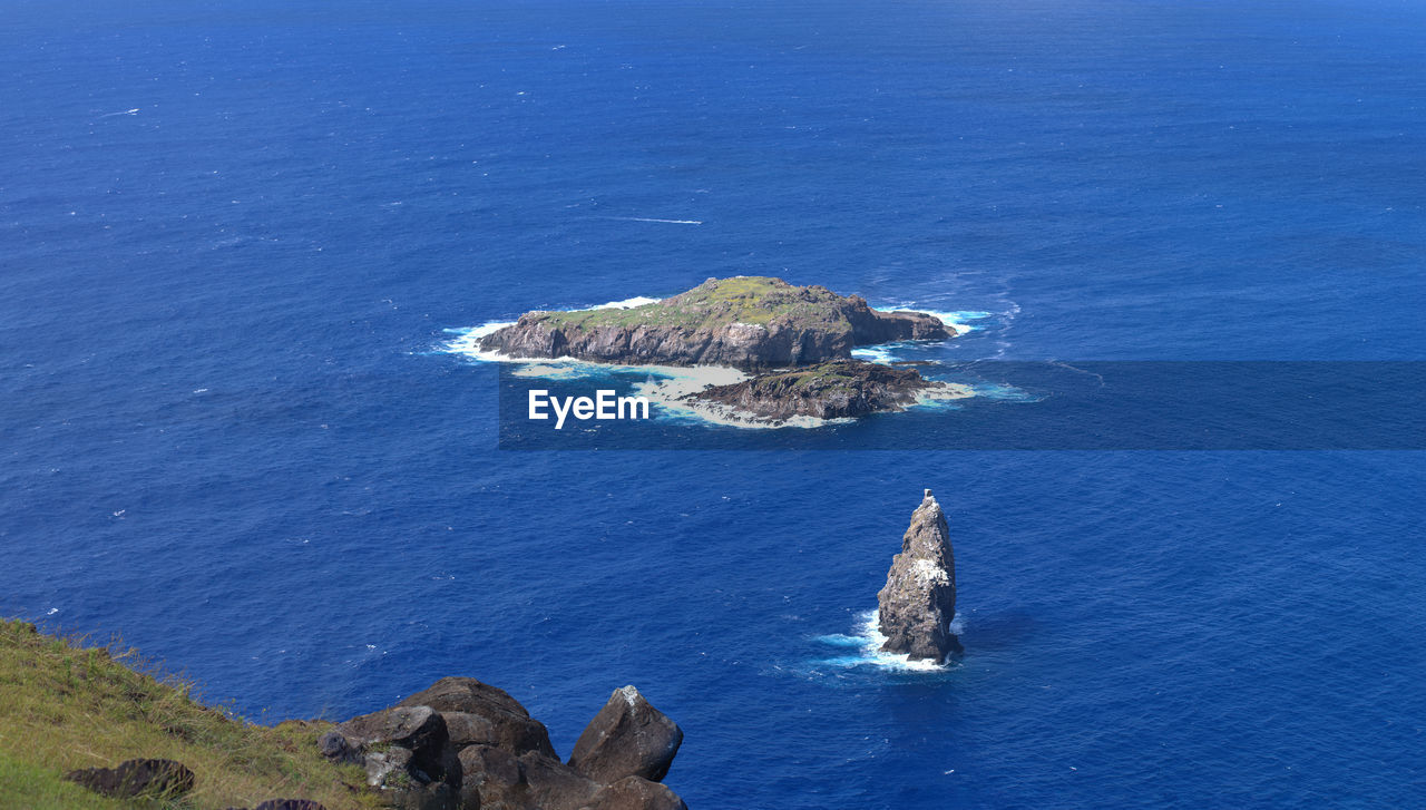 High angle view of rocks in sea