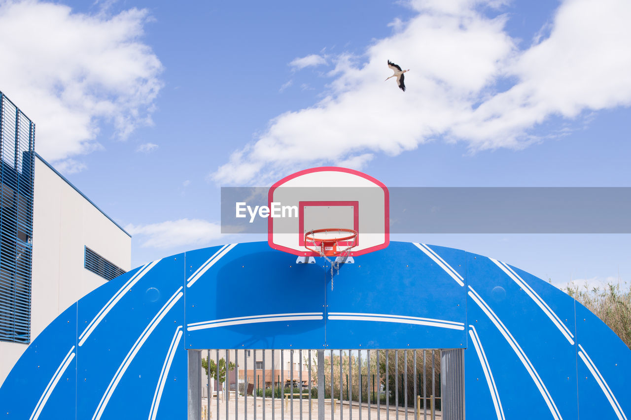 Low angle view of basketball court against sky