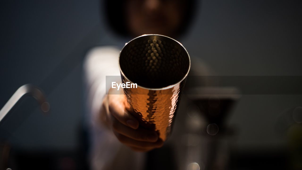 Close-up of girl holding drinking glass