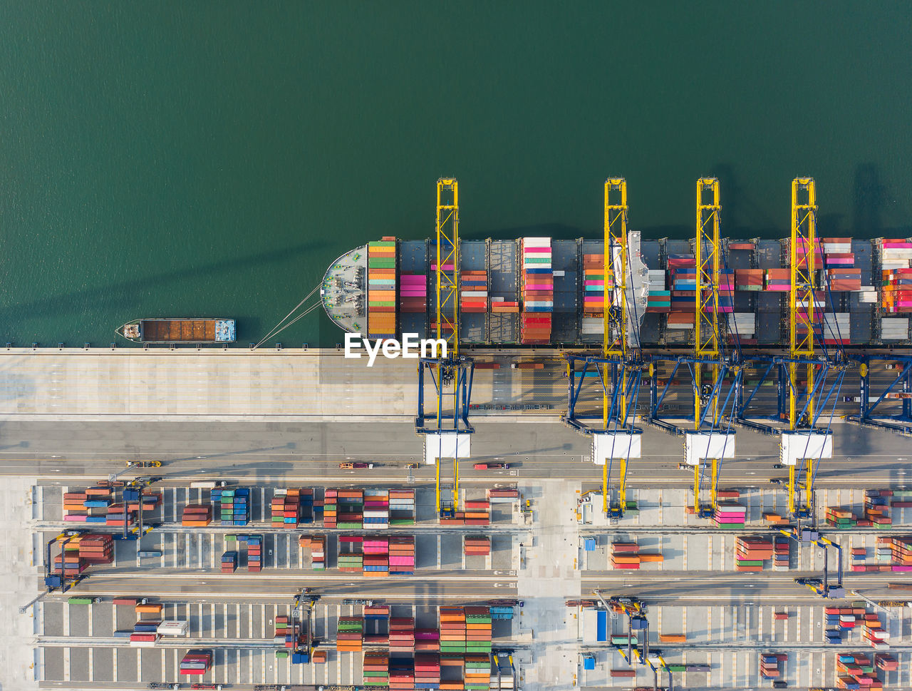Aerial view of container ship moored at harbor