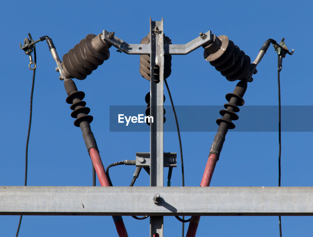 LOW ANGLE VIEW OF MACHINERY AGAINST SKY