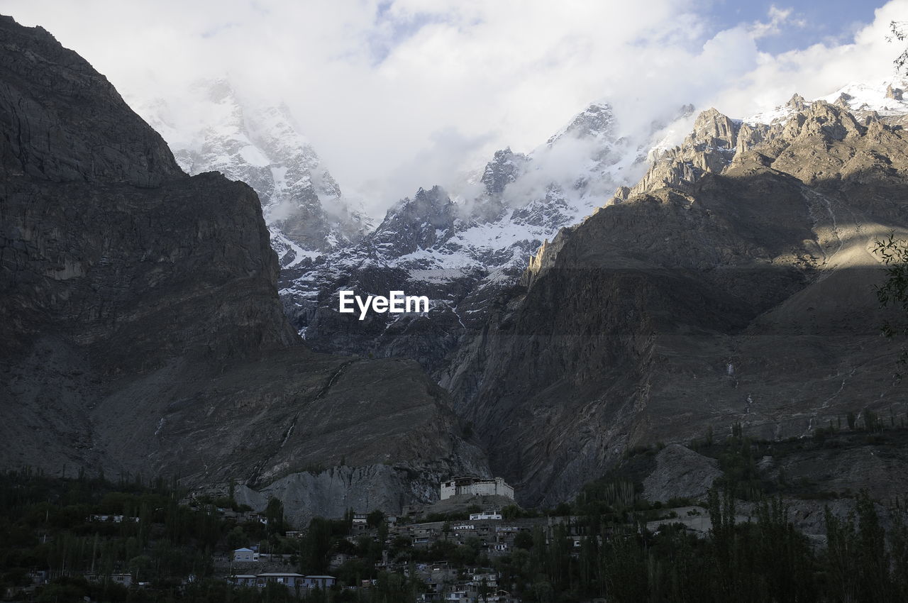 Scenic view of mountains against sky during winter