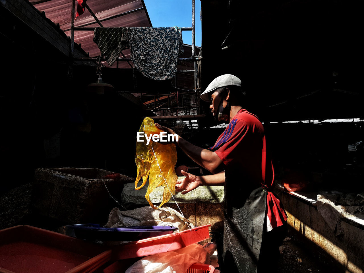 Man working at market stall