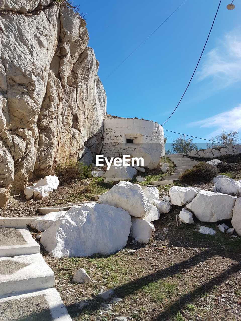Rock formation against blue sky on sunny day