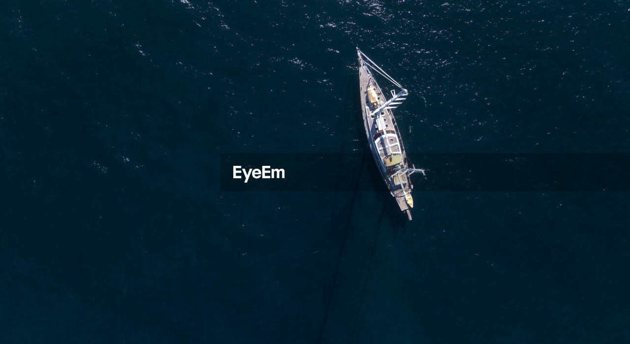 Aerial drone view of a yacht boat on ocean