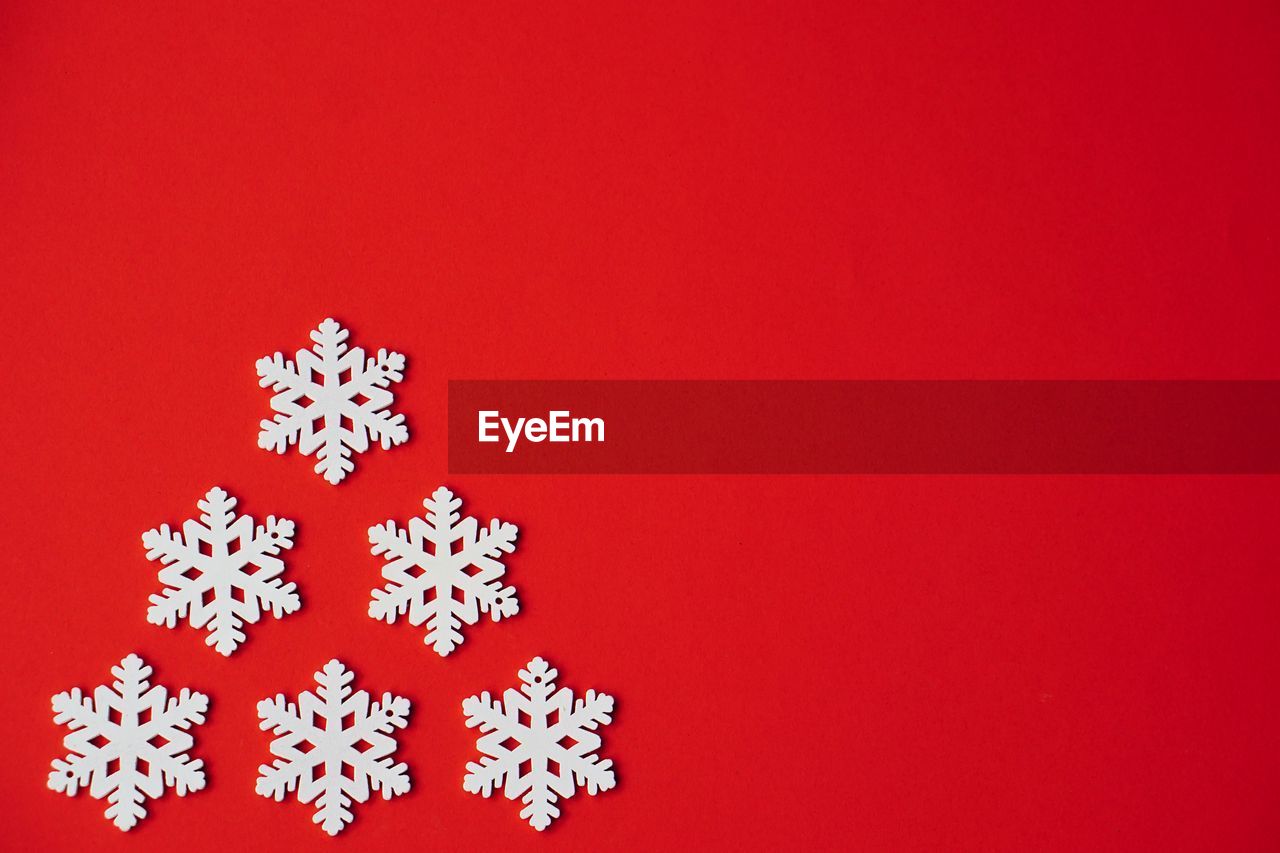 Snowflakes against red background