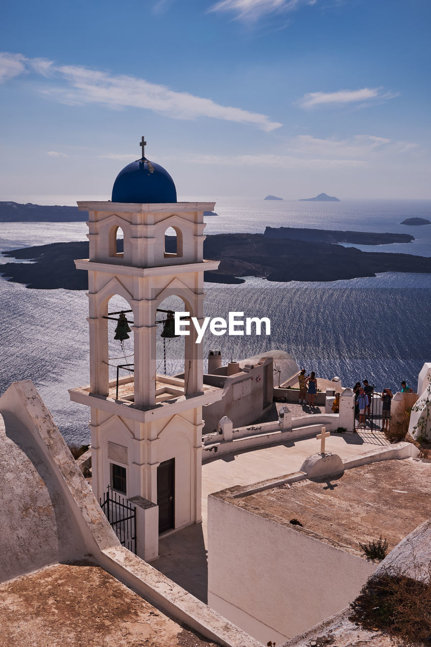 Anastasis church with its blue dome and tower in imerovigli village, santorini, greece