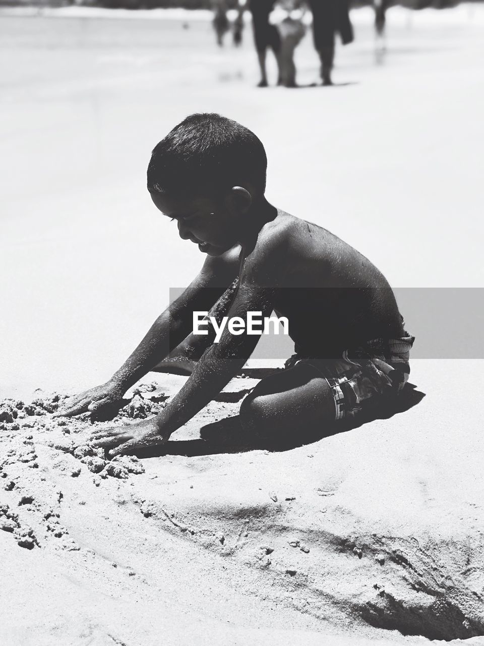 CLOSE-UP OF MAN ON SAND