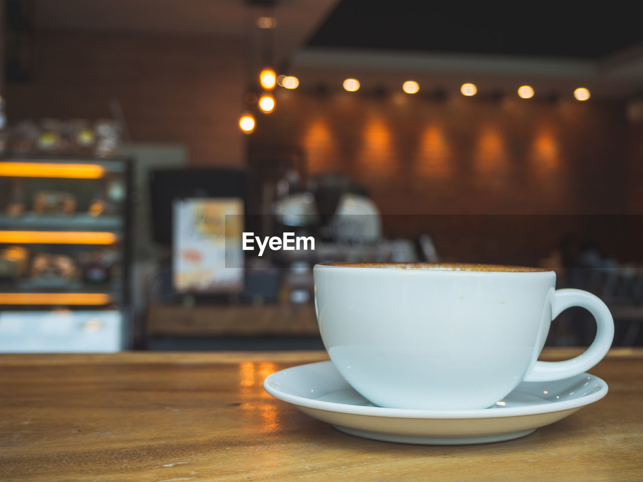 CLOSE-UP OF COFFEE IN CUP ON TABLE