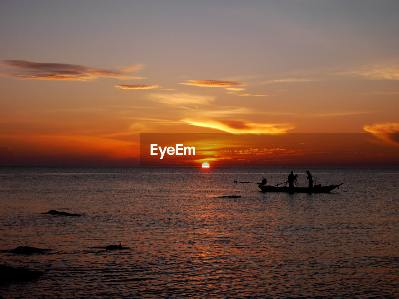 SCENIC VIEW OF SEA AGAINST ORANGE SKY DURING SUNSET