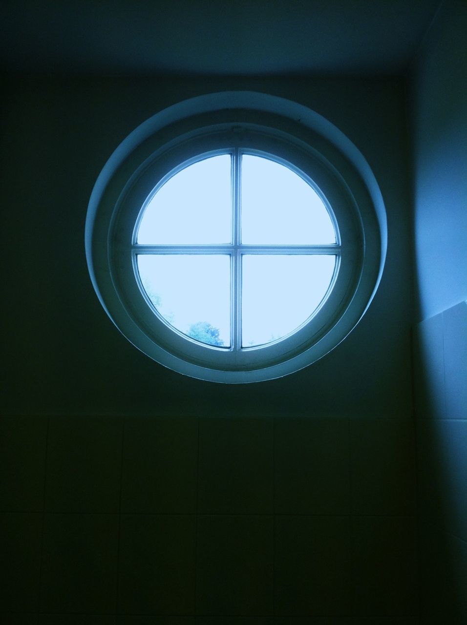 Porthole style window with clear sky view
