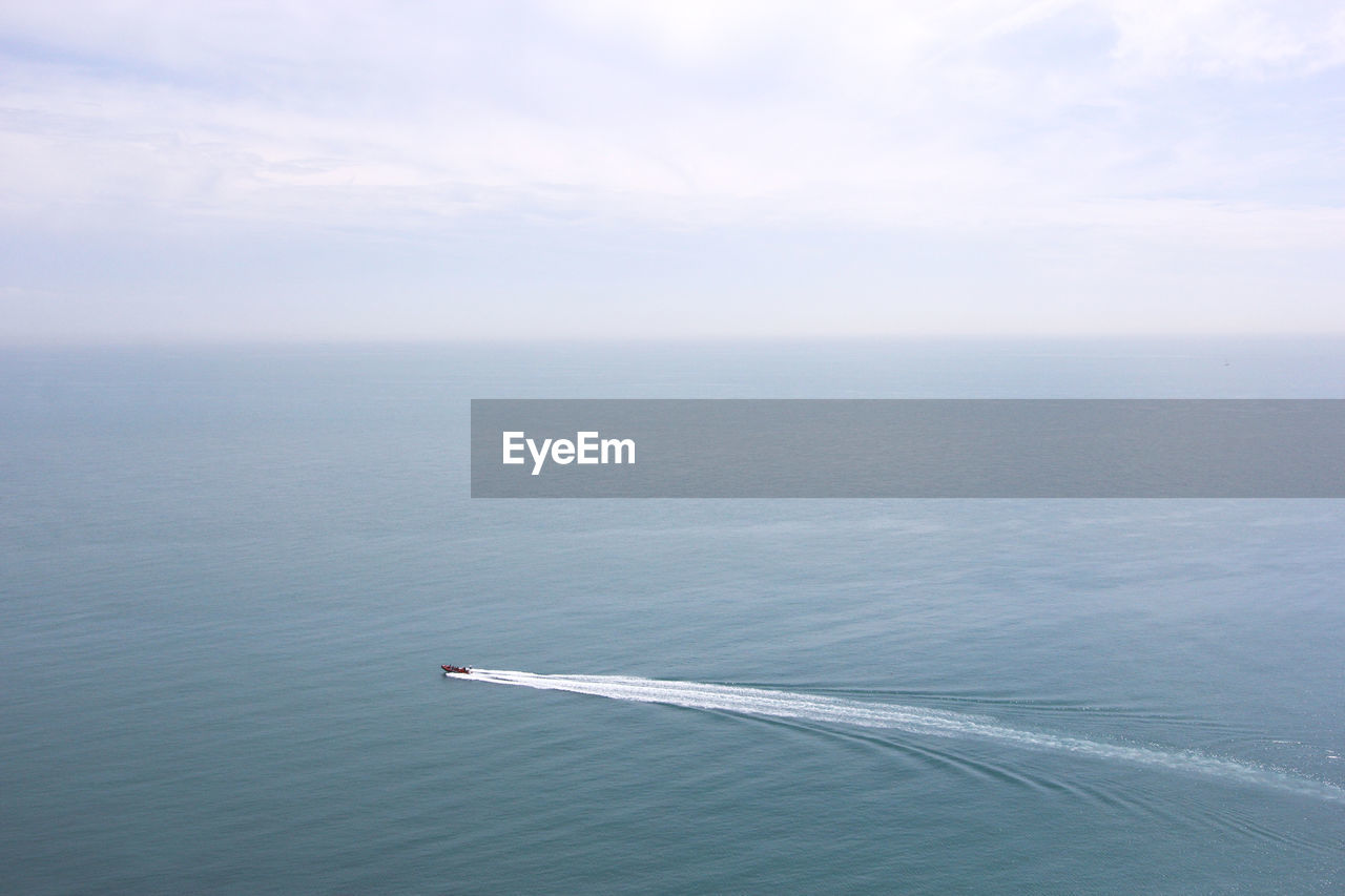 High angle view of boat in sea against sky