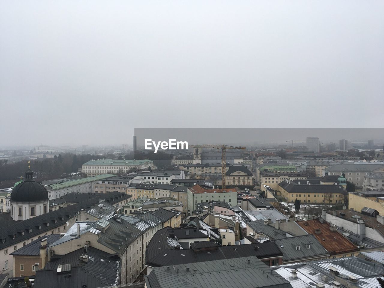 HIGH ANGLE VIEW OF CITY AGAINST SKY