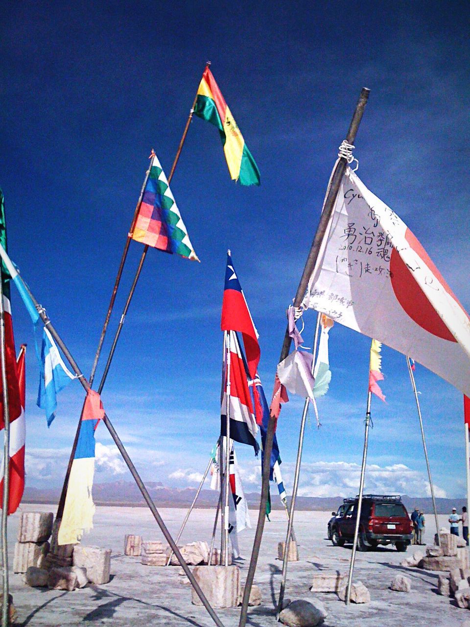 Low angle view of national flag against blue sky