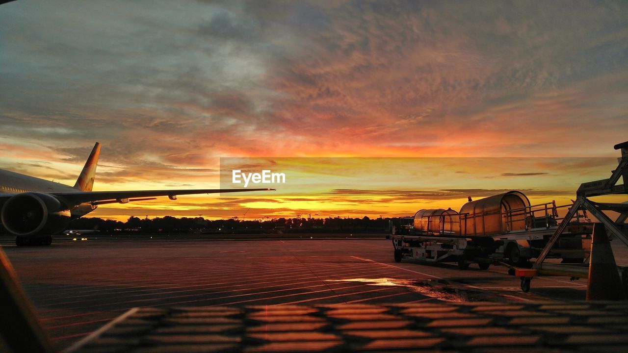 AIRPLANE ON RUNWAY AGAINST SKY