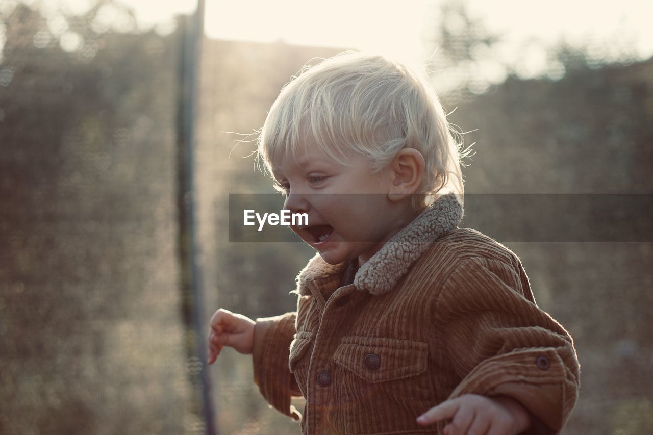 Portrait of cute boy looking away